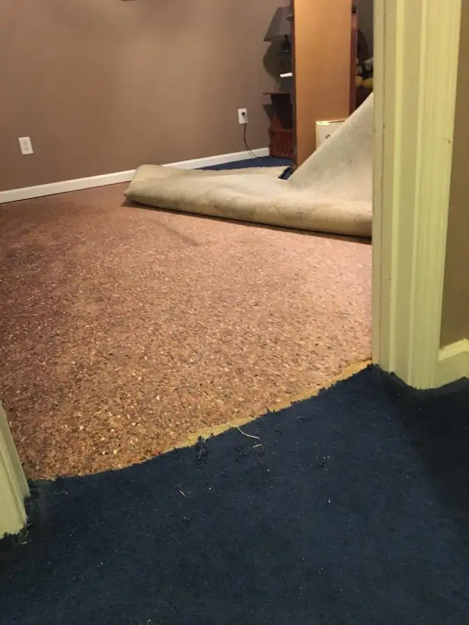 Carpet pad removal revealing water damage during Water Mitigation Services in Vandenberg Village